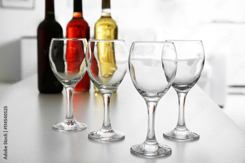 Wineglasses on blurred interior background