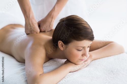Relaxed woman enjoying back massage