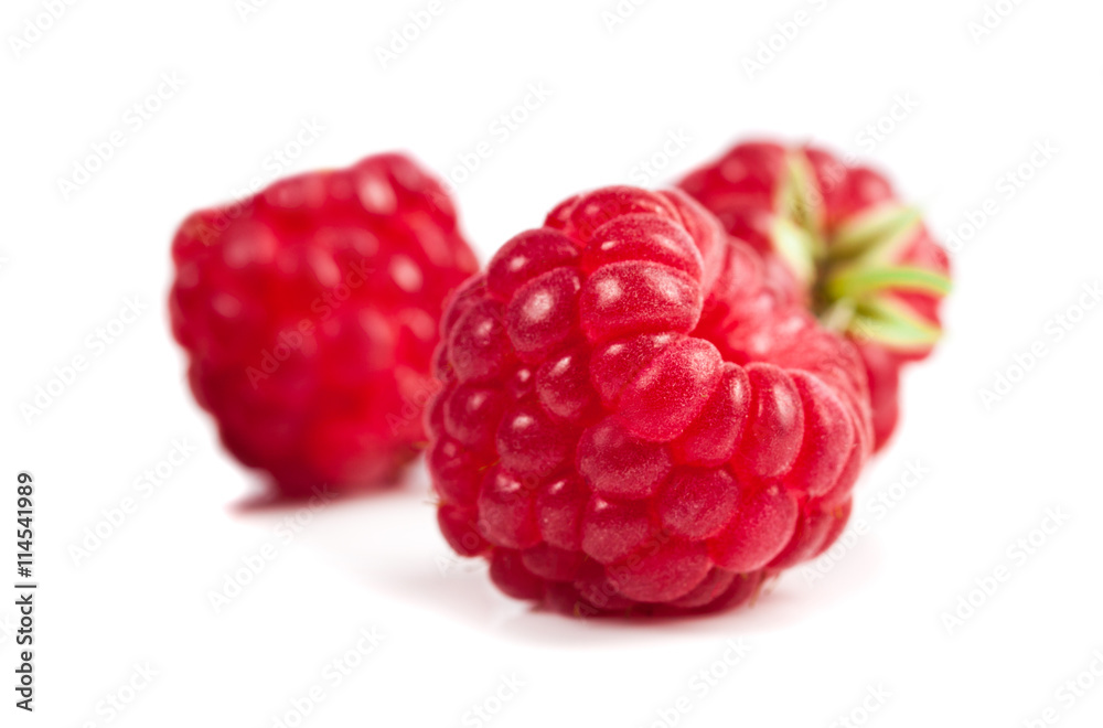 ripe raspberries on white background. Red juicy berries closeup. ripe raspberries on white background. Red juicy berries closeup.