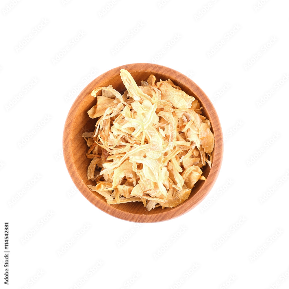 Dried slices onion in small wooden bowl isolated on white Dried slices onion in small wooden bowl isolated on white