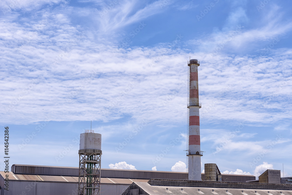 The smokestack,the smokestack of the factory with the blue sky day.