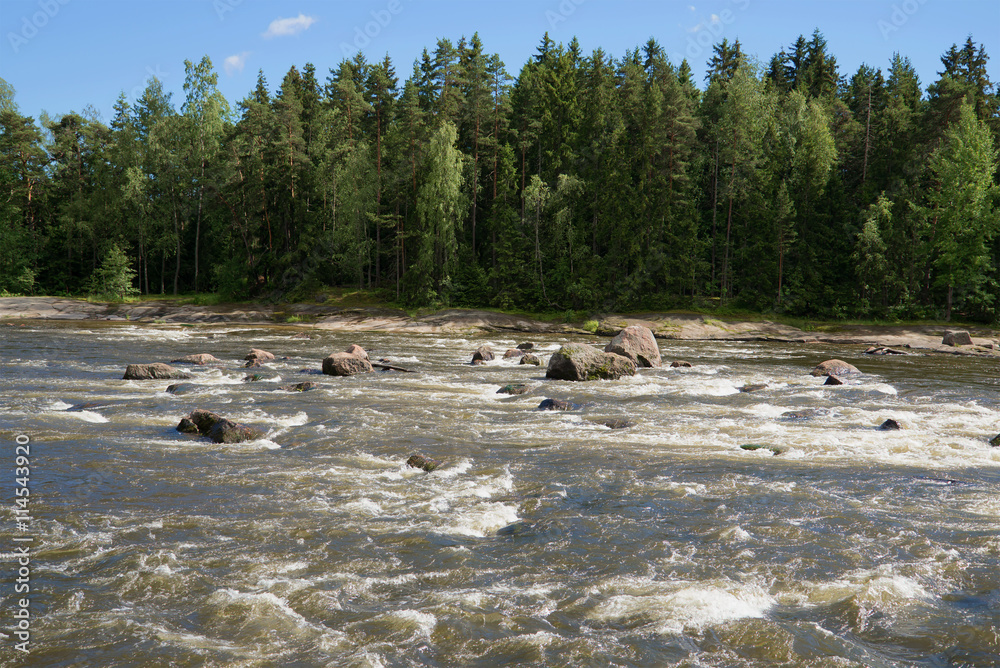 Sunny summer day on the river Kymiyoki. Langinkoski, Finland Sunny summer day on the river Kymiyoki. Langinkoski, Finland