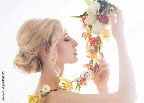 Beautiful, sensual bride in a white dress flowers