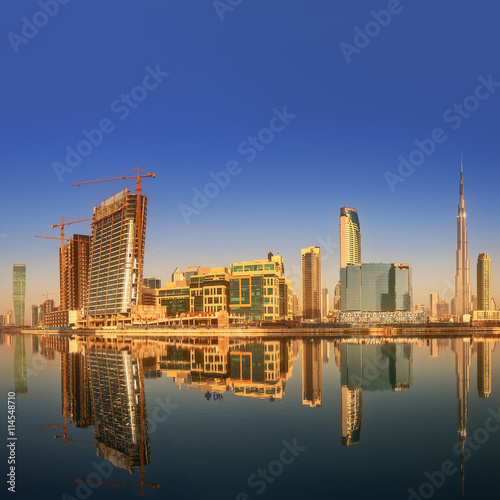 Panoramic view of Business bay and downtown area of Dubai  reflection in a river  UAE