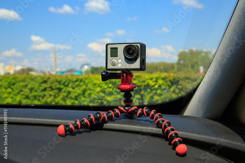 Mini camera on a support on the windshield of a car