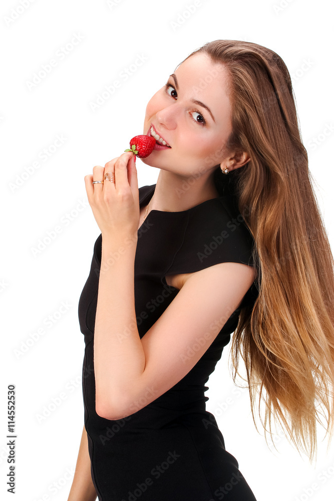Pretty woman with strawberry in hand isolated on white Pretty woman with strawberry in hand isolated on white