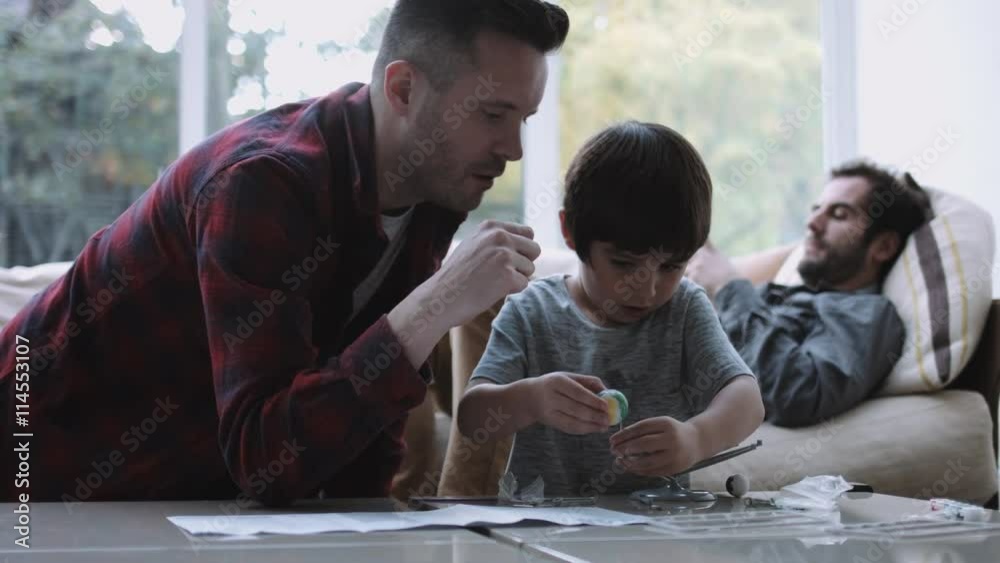 Same sex couple family together, Father and son playing and painting Same sex couple family together, Father and son playing and painting