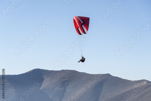 Paragliding flying in the sky.