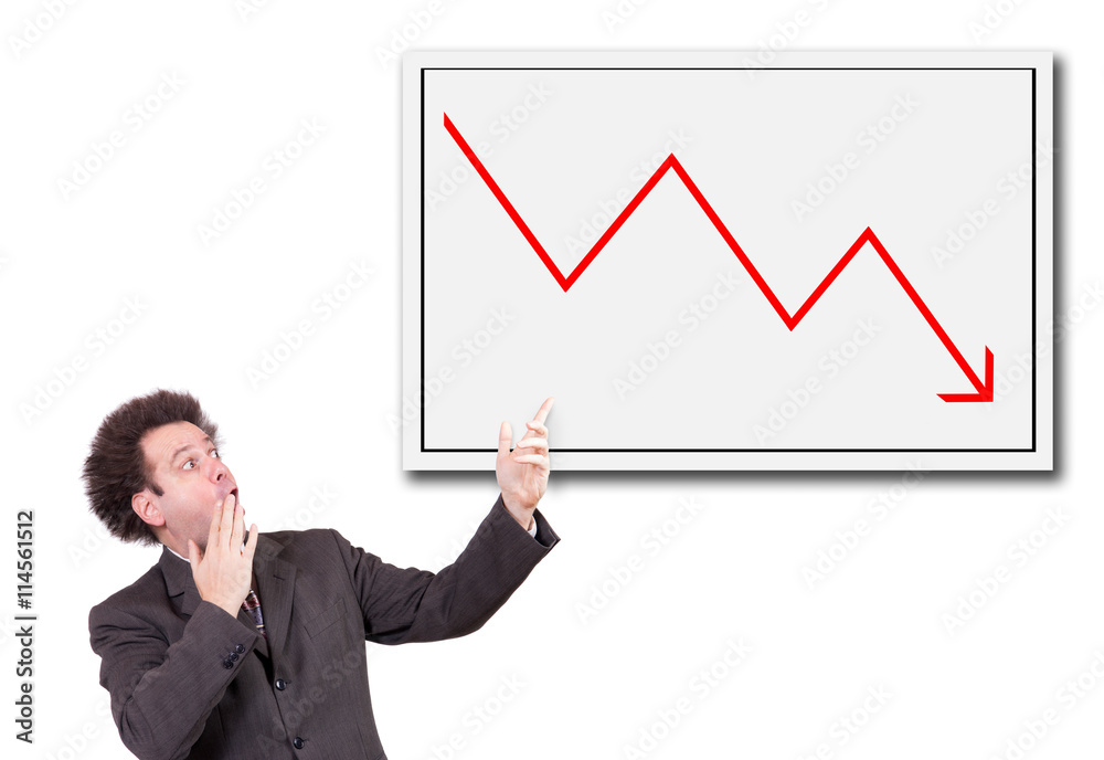 Shocked man in a suit shows a hand on the board with a declining arrow. Businessman has the shock of rapid decline in stocks. Shocked man in a suit shows a hand on the board with a declining arrow. Businessman has the shock of rapid decline in stocks.