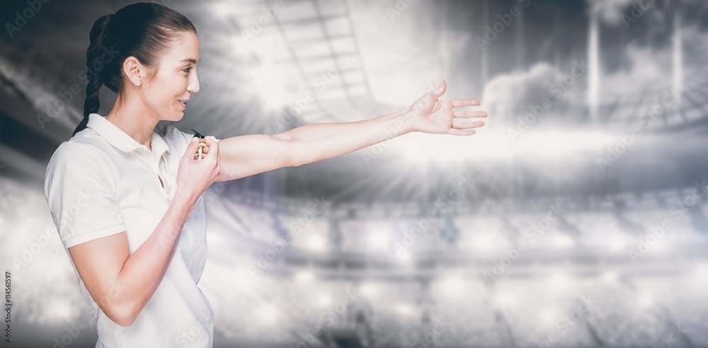 Composite image of female athlete blowing a whistle and pointing Composite image of female athlete blowing a whistle and pointing