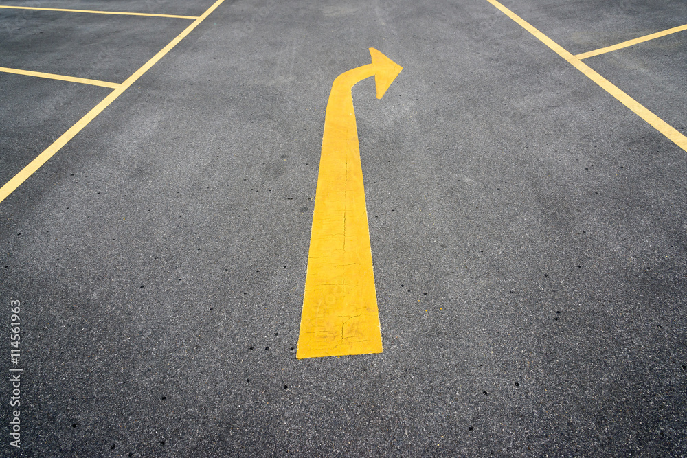 Arrows on asphalt road showing turn right