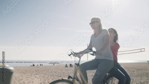 Wallpaper Mural Young Adult Tourists cycling on beach in summer Torontodigital.ca