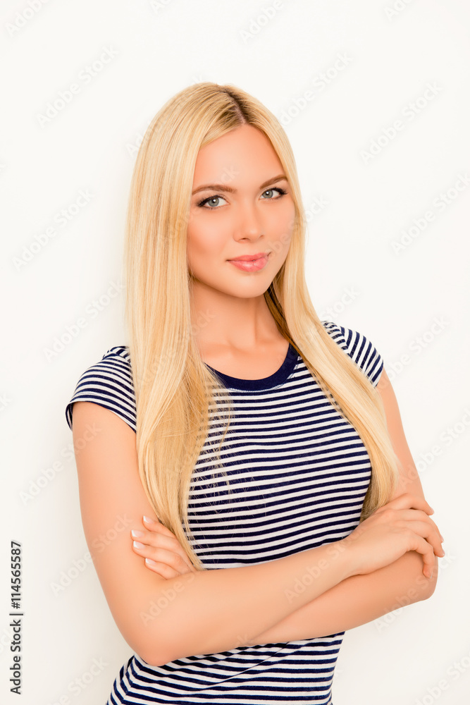Pretty happy young blonde woman with crossed hands Pretty happy young blonde woman with crossed hands