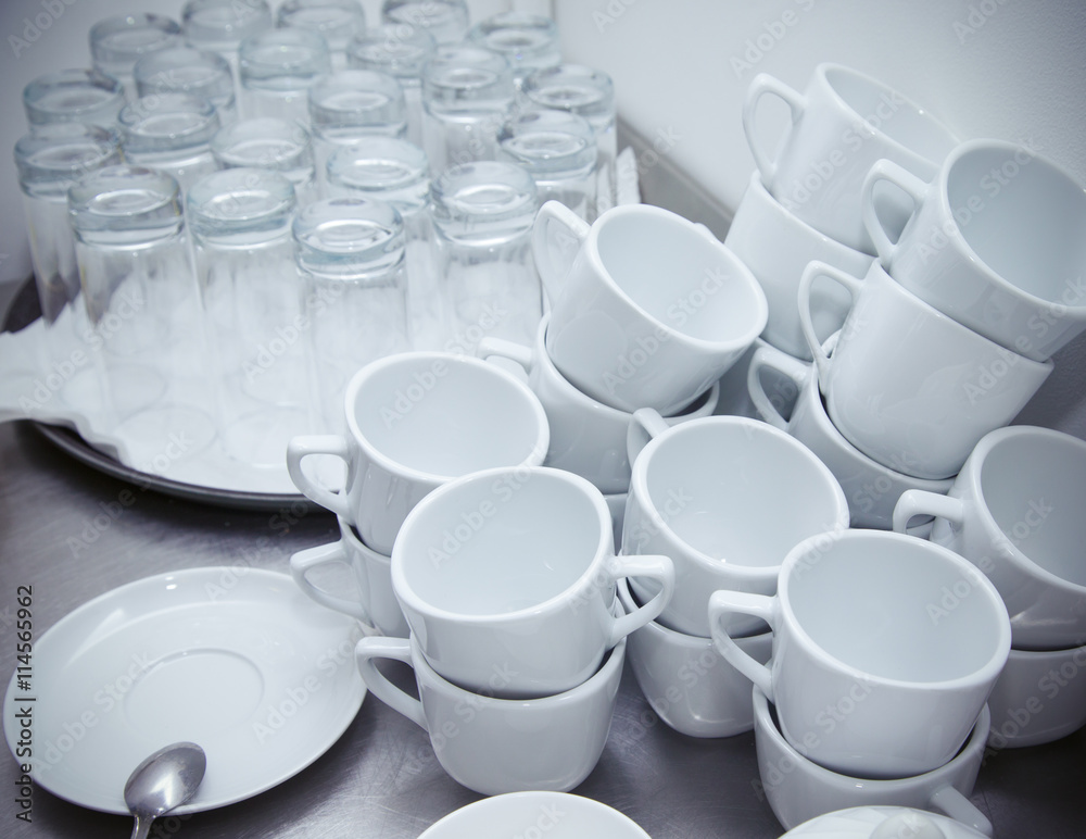 Cups and glasses on a restaurant kitchen. Selective focus. Shall Cups and glasses on a restaurant kitchen. Selective focus. Shall