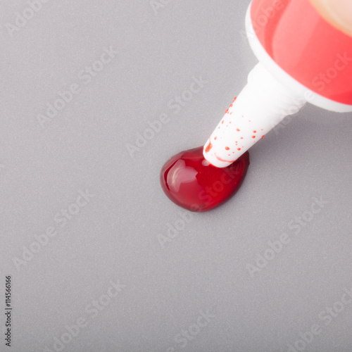 Drop of food coloring on a light background