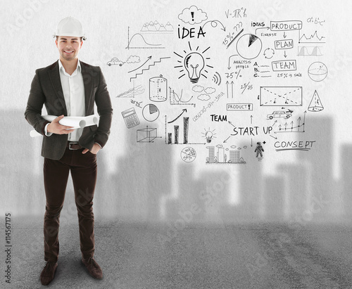Architect man in hardhat is...
