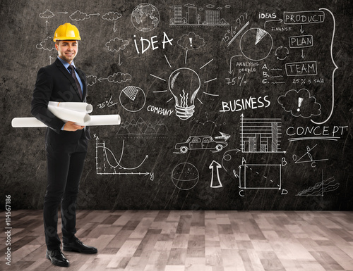 Architect man in hardhat on...