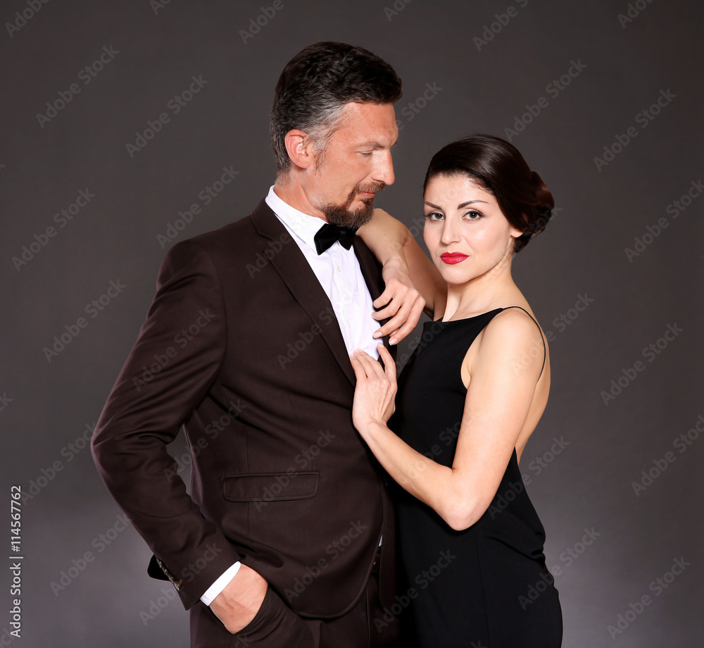 Happy mature couple on dark background Happy mature couple on dark background