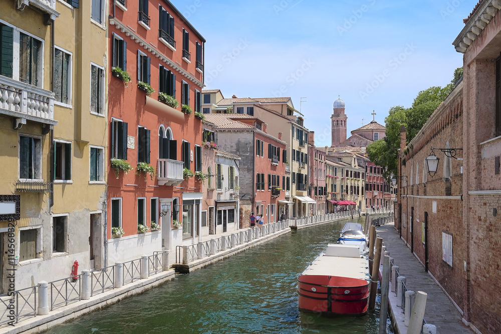 Venice, Italy, June, 21, 2016: landscape with the image of boats on a channel in Venice, Italy