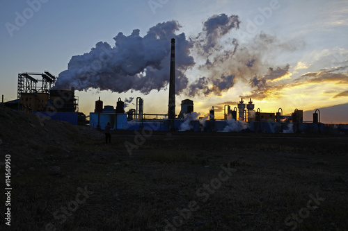 Industrial plant equipment in the sunset
