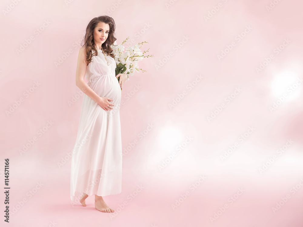 Young pregnant nymph holding a bouquet of a wildflowers Young pregnant nymph holding a bouquet of a wildflowers