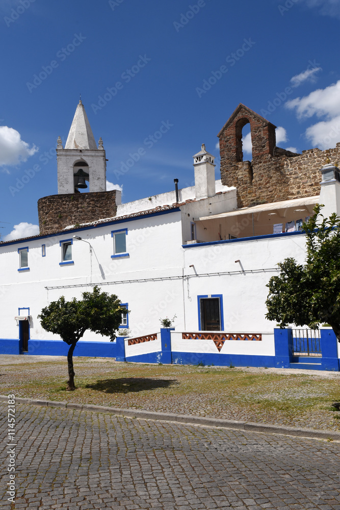 Houses in front of the castle walls and church Sinera the village of Redondo, Portugal