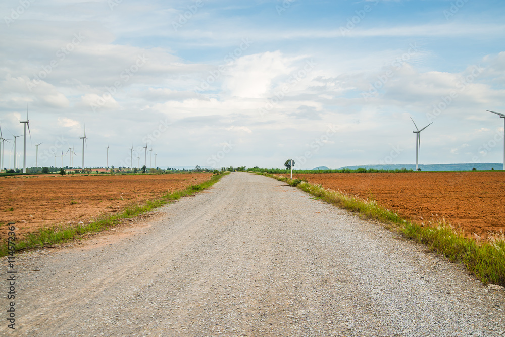Road for Wind turbines generate electricity at field all  agriculture plantation in thailand