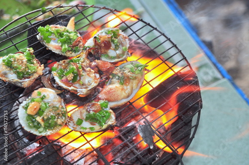 Grilling shellfish and seafood on hot fire