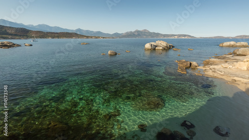 Calvi bay in Corsica with shallow water and rocks © Jon Ingall
