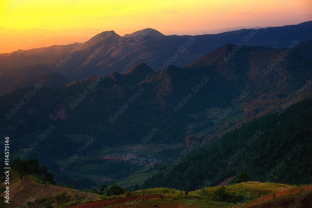 Fototapeta premium Mountain and hill tribe village at sunset in Thailand.