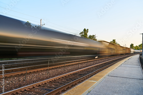 Freight Train Moves Along Tracks