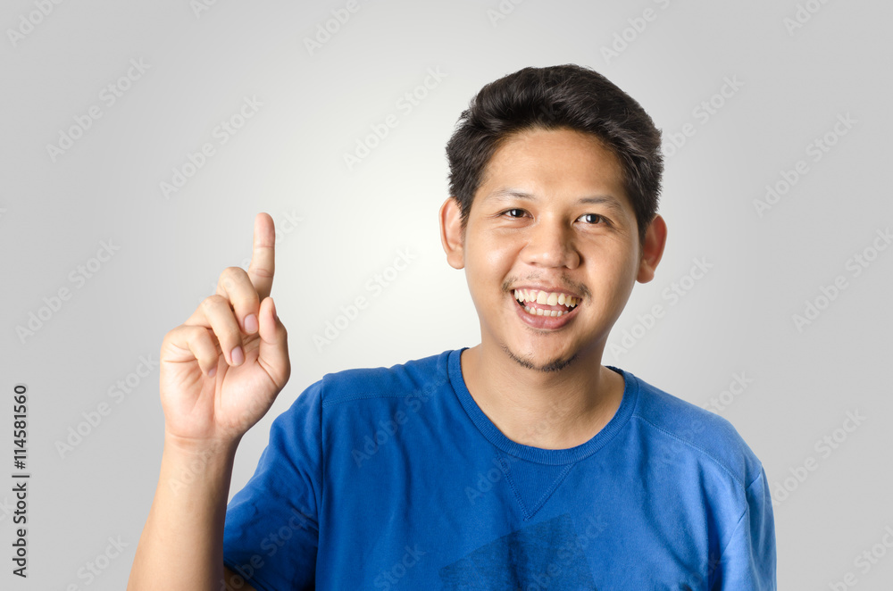 Asia man showing number one,isolated on gray background Asia man showing number one,isolated on gray background