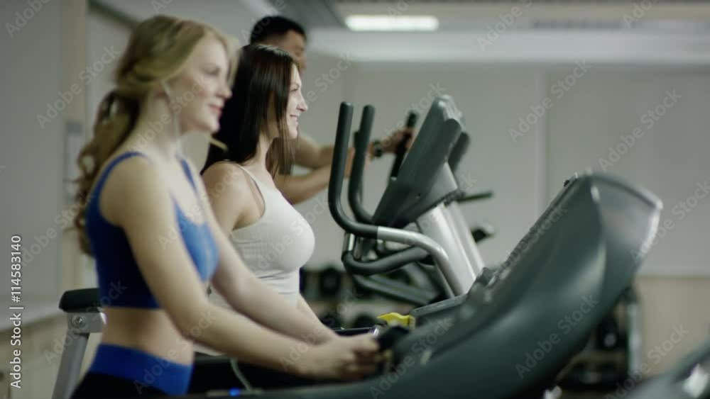 smiling people walking on treadmill smiling people walking on treadmill