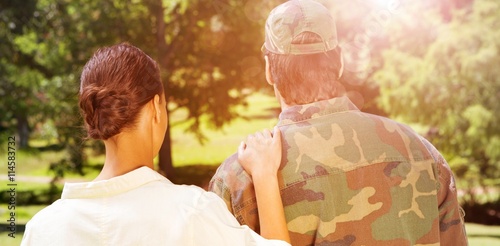 фотографія Rear view of solider and wife