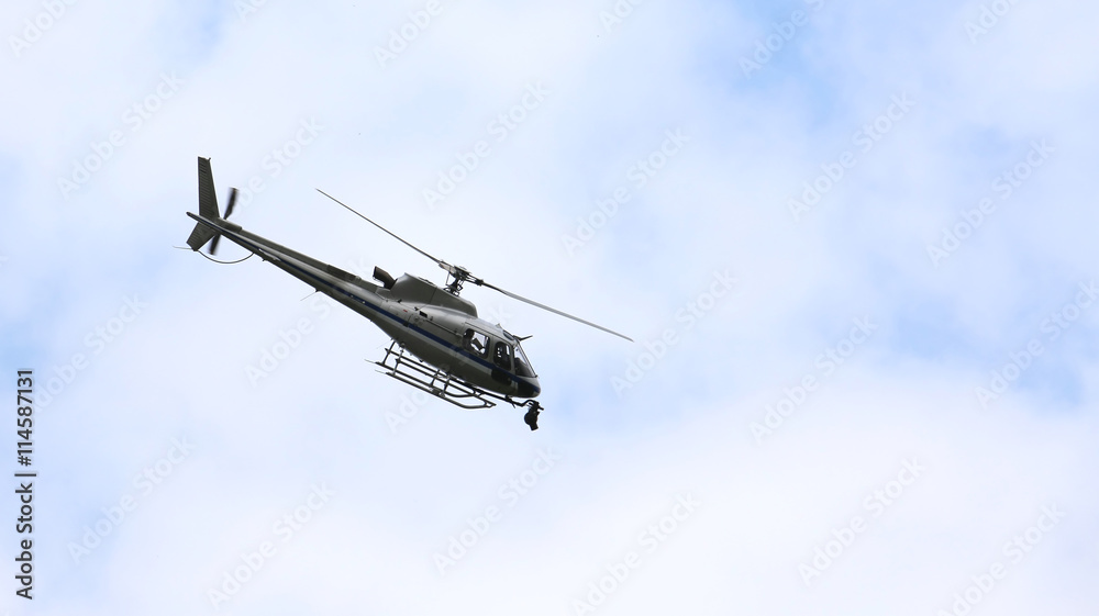 Fototapeta premium helicopter flying in the sky with the camera for TV top