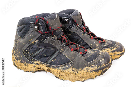 Close-up of muddy shoes after a hike on the mountain.
