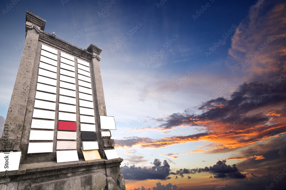 Stone billboard with a lot of blank signboard, with copy space on sky in sunset Stone billboard with a lot of blank signboard, with copy space on sky in sunset