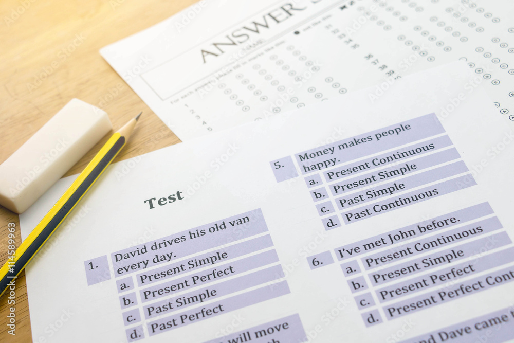 english exercise and answer sheet and pencil on table with gradi english exercise and answer sheet and pencil on table with gradi