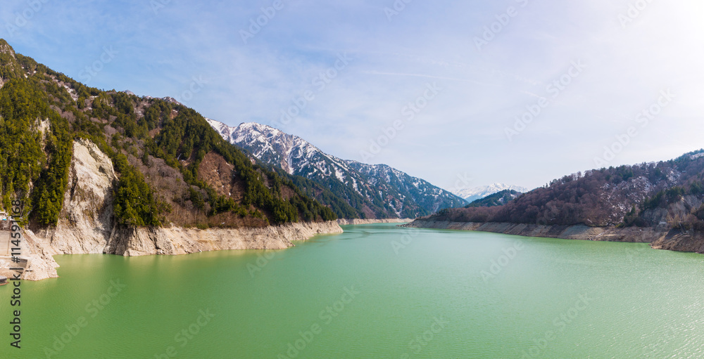 Landscape of mountains with green lake at Kurobe dam.