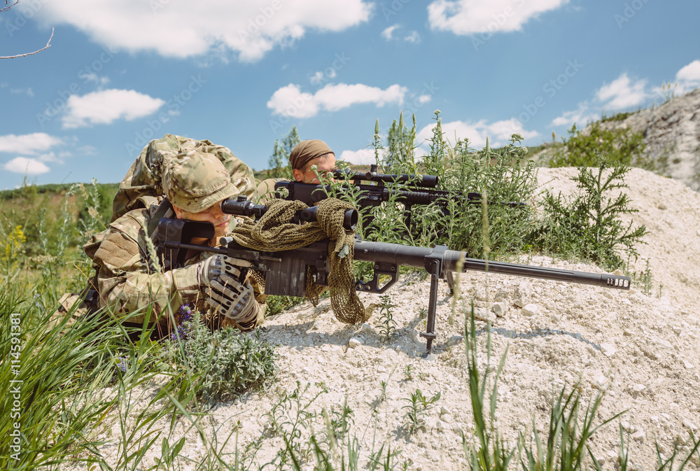 Army sniper during the military operation in the mountain. war,