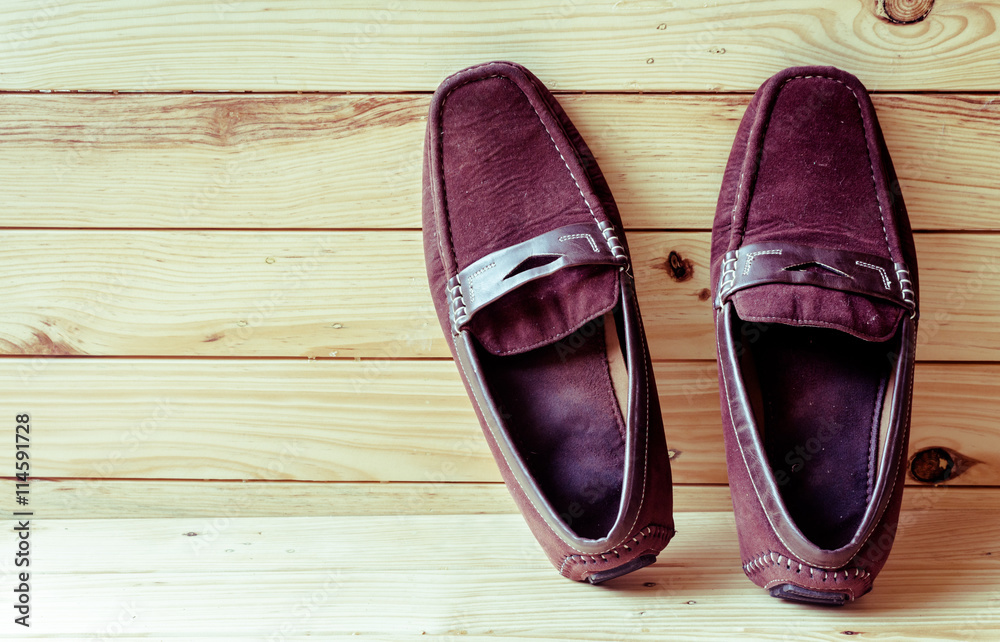 Canvas shoes on wooden background Canvas shoes on wooden background