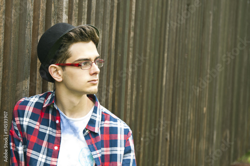 young man with glasses and hat photo