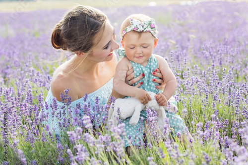 Mother with baby girl in lavender field