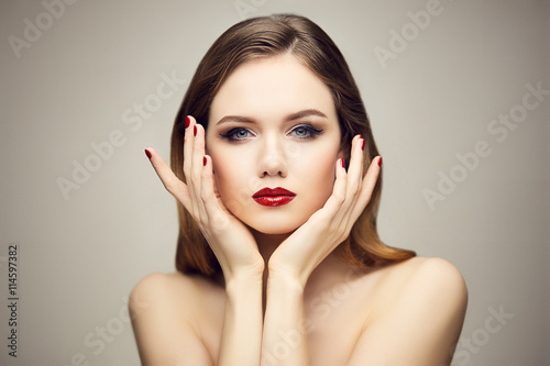 Red lips girl touching her face