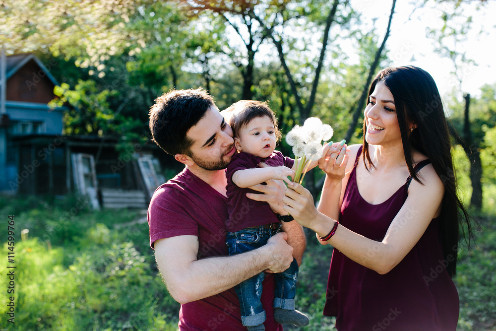 young family with a child on the nature young family with a child on the nature