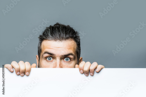 scared man with paper photo