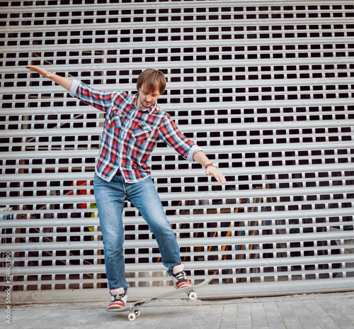 Young man riding a skateboard © romaset