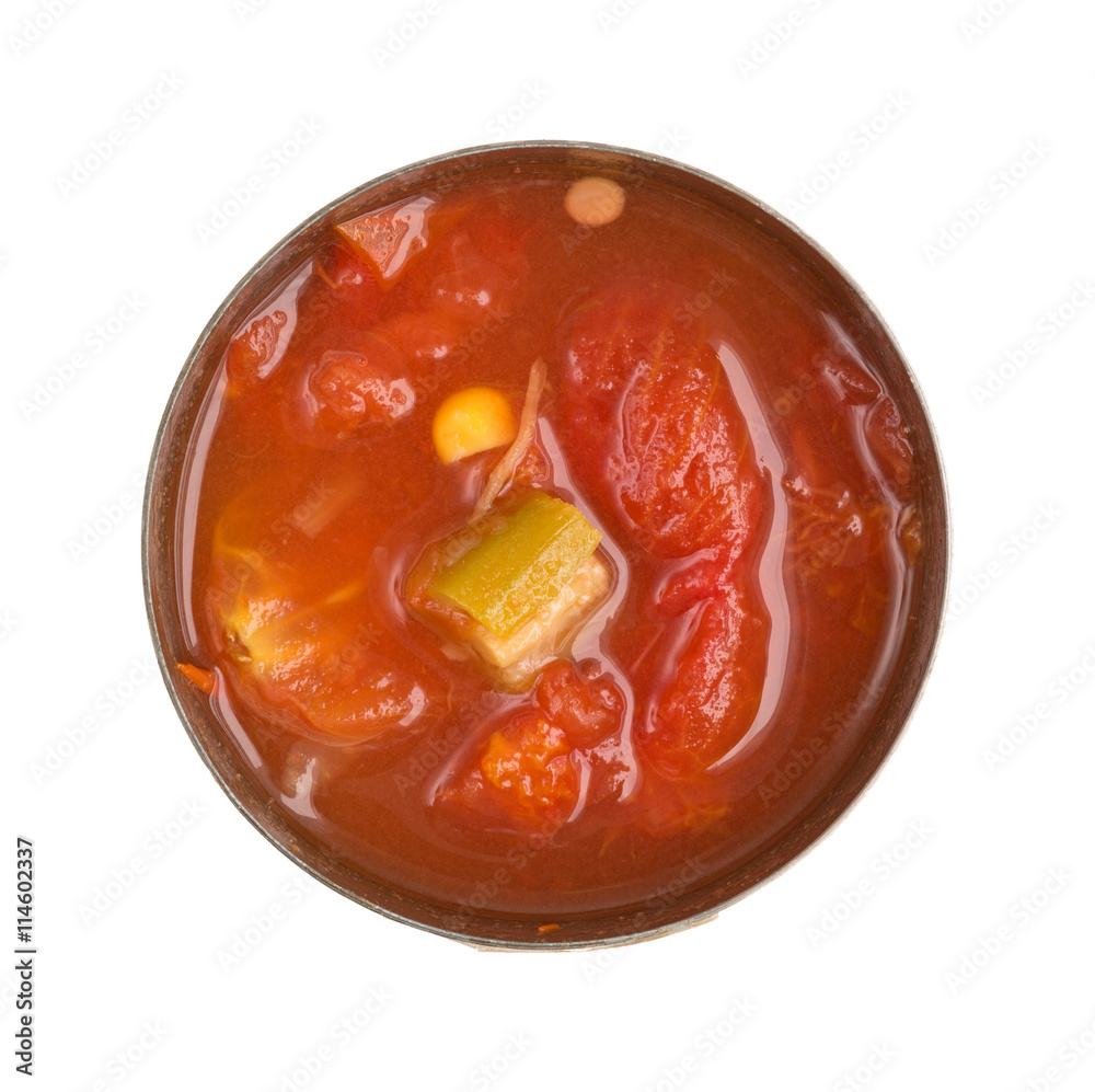 Corn okra and tomatoes soup in an opened can isolated on a white background. Corn okra and tomatoes soup in an opened can isolated on a white background.
