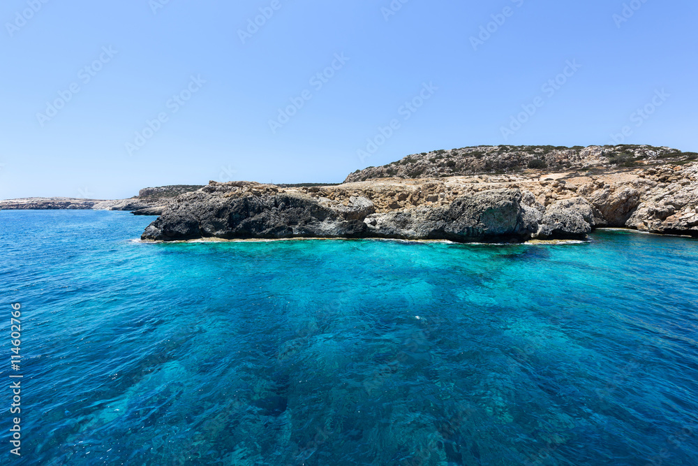 Pirate bay in protaras paralimni, blue sea, immaculate water and rocks, cyprus island