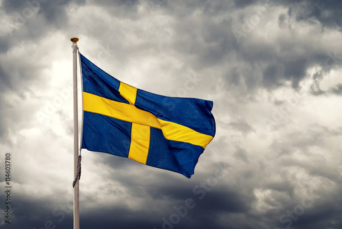 Swedish national flag waving on cold windy day